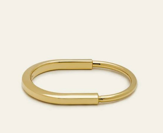 Striking Gold-Tone Statement Kada with a bold design.