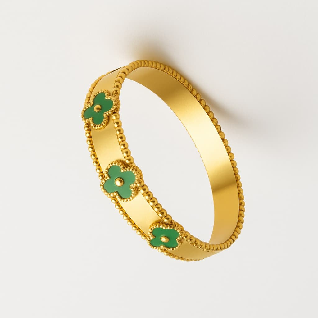 Elegant Gold-Tone Bracelet with Green Clover Accents