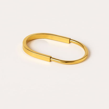 Striking Gold-Tone Statement Kada with a bold design.