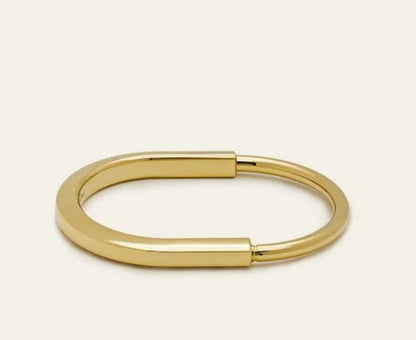 Striking Gold-Tone Statement Kada with a bold design.