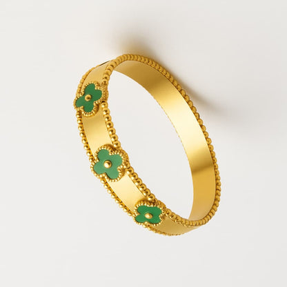 Elegant Gold-Tone Bracelet with Green Clover Accents