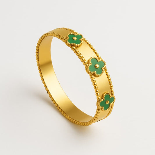 Elegant Gold-Tone Bracelet with Green Clover Accents